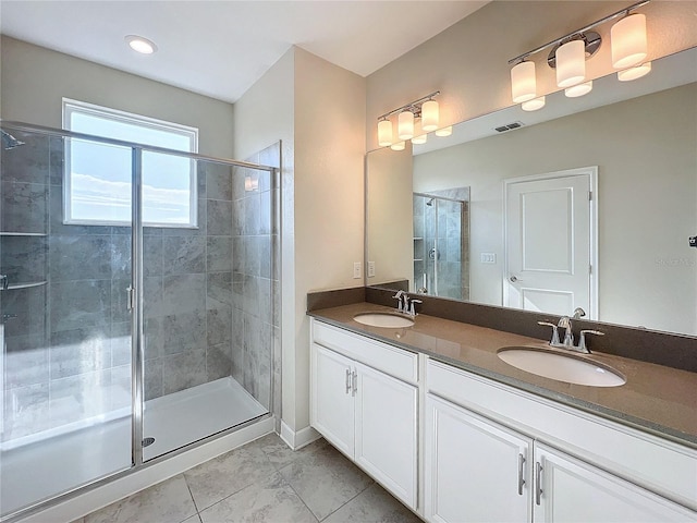 bathroom featuring tile patterned flooring, vanity, and walk in shower