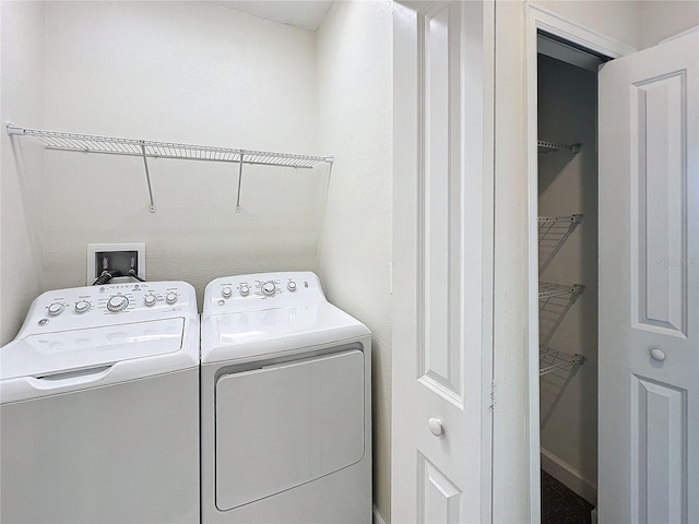 laundry room featuring separate washer and dryer