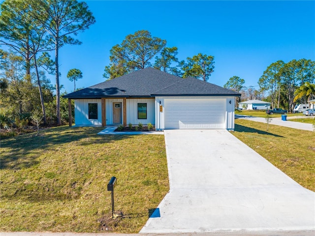 view of front facade with a front yard and a garage