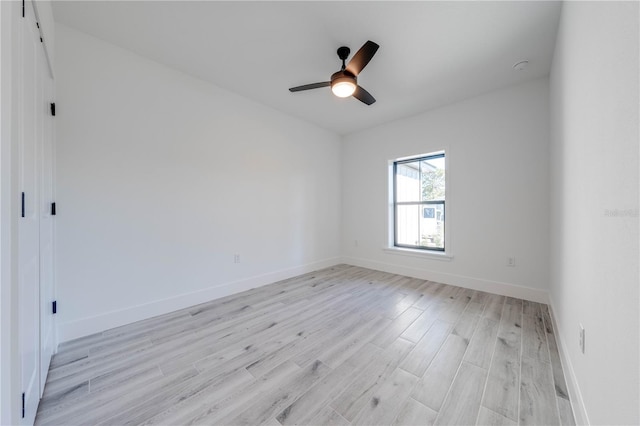 unfurnished room featuring light wood-type flooring and ceiling fan