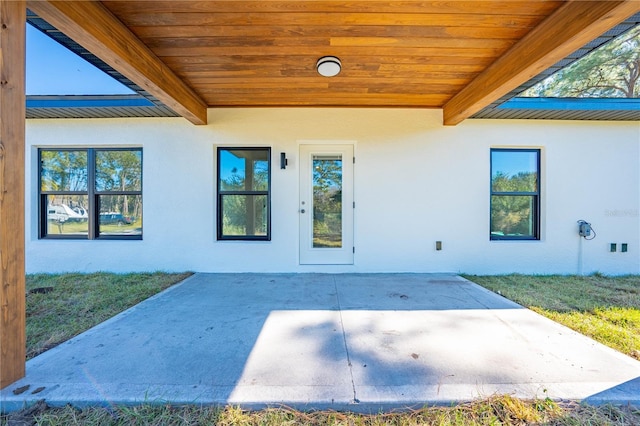 doorway to property featuring a patio area