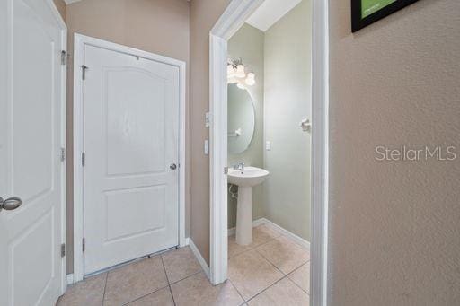 bathroom with tile patterned floors and sink