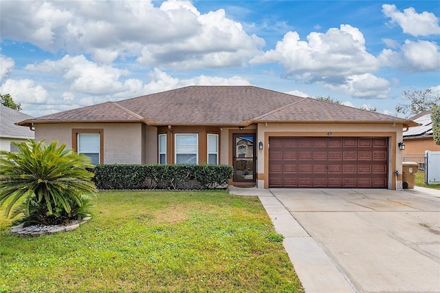 single story home with a front yard and a garage