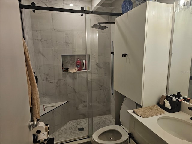 bathroom featuring a shower with door, vanity, and toilet