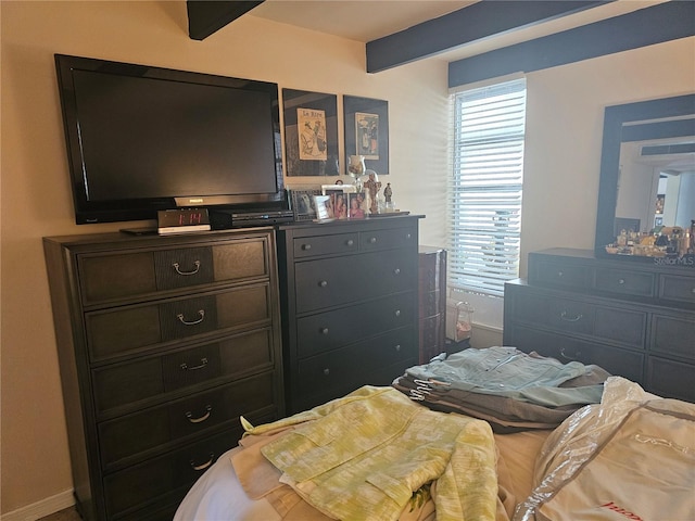 bedroom with beamed ceiling