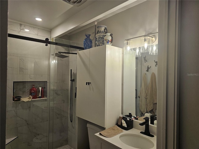 bathroom with an enclosed shower and vanity