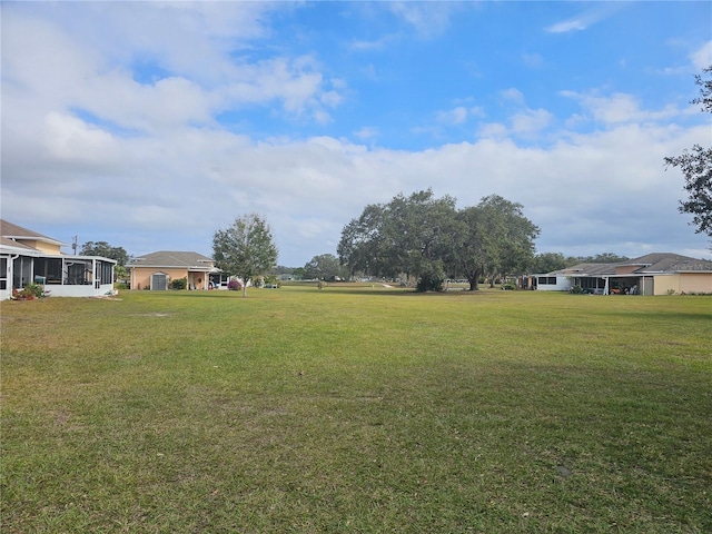 view of yard featuring a sunroom