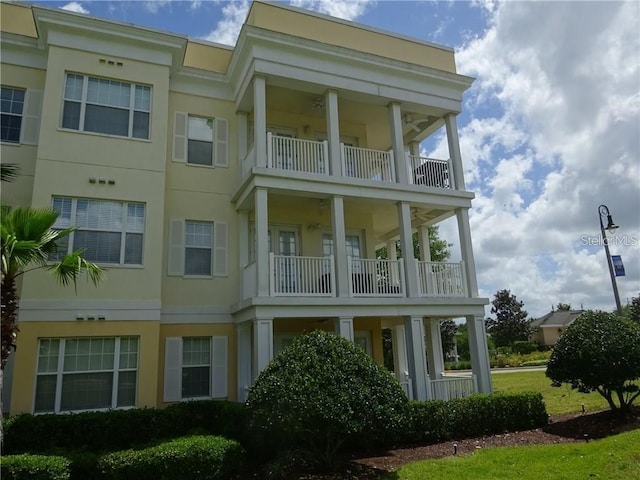 view of home's exterior with a balcony