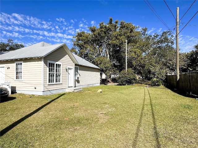 view of home's exterior with a lawn