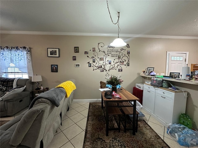 tiled dining space featuring crown molding