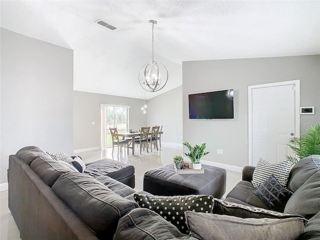 living room featuring lofted ceiling and a chandelier