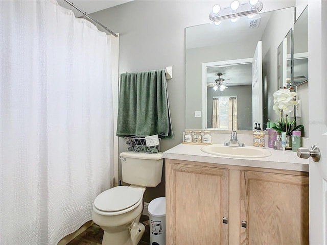 bathroom with ceiling fan, vanity, and toilet