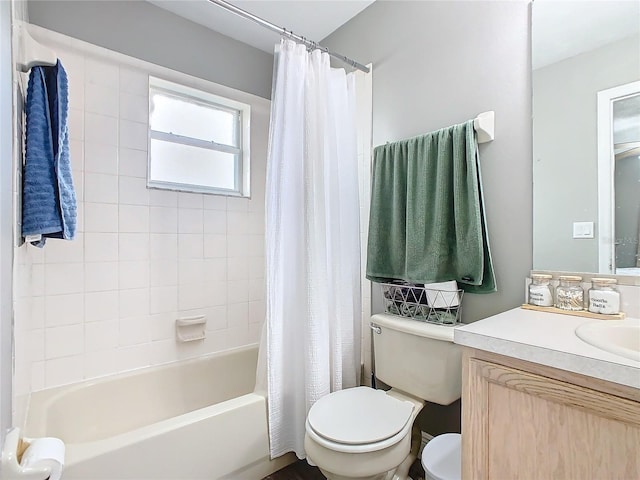 full bathroom featuring toilet, shower / bath combination with curtain, and vanity