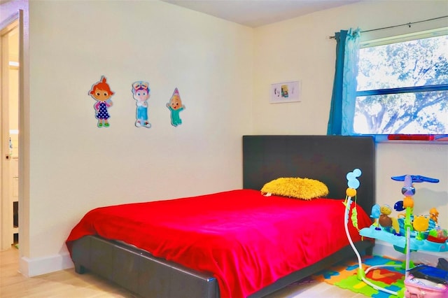 bedroom with light wood-type flooring