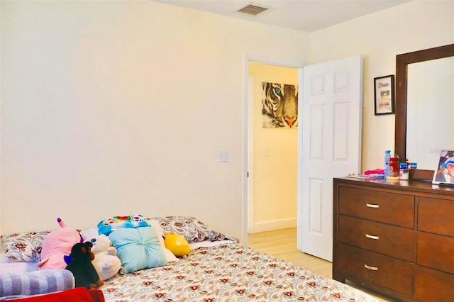 bedroom featuring light wood-type flooring