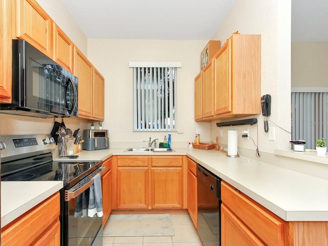 kitchen with light tile patterned floors, black appliances, and sink