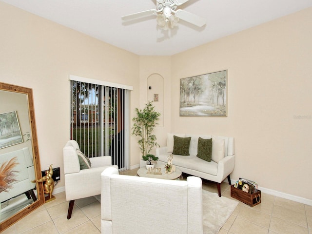 living room featuring ceiling fan and light tile patterned floors