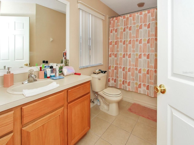 full bathroom with toilet, vanity, tile patterned floors, and shower / bath combo with shower curtain