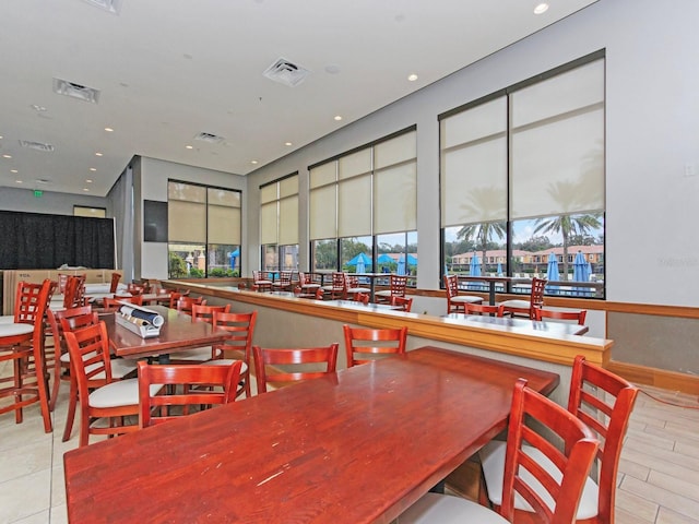 dining space with light hardwood / wood-style floors