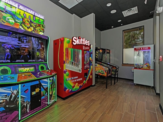 playroom with a paneled ceiling