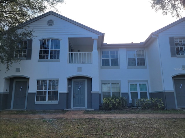 view of front of house featuring a balcony