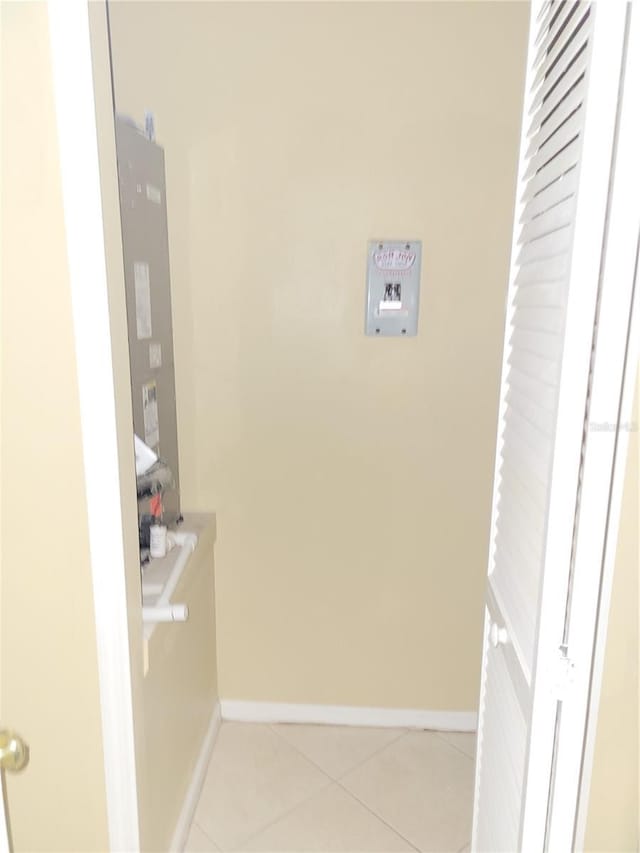 laundry room featuring light tile patterned flooring