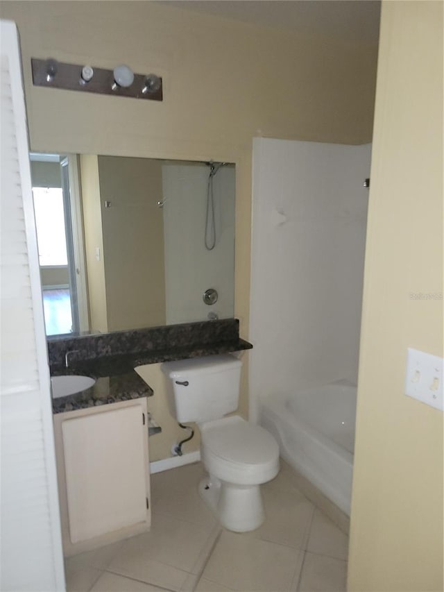 full bathroom with shower / bath combination, vanity, tile patterned floors, and toilet