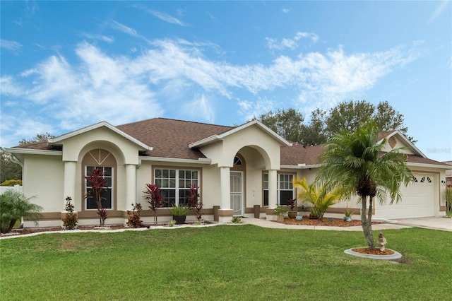 ranch-style home featuring a garage and a front lawn