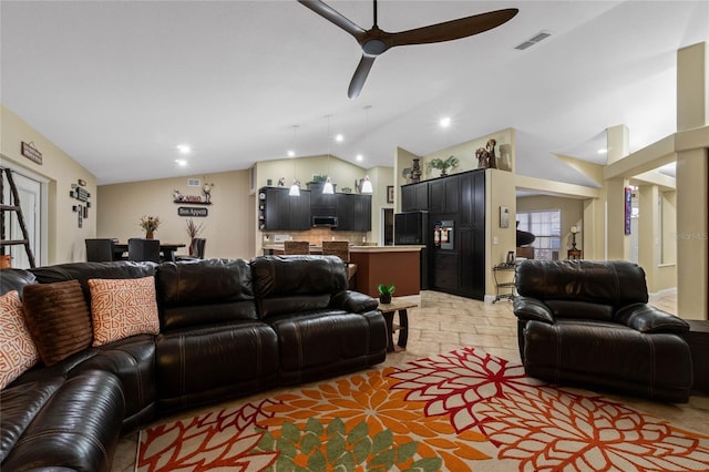 living room with ceiling fan and lofted ceiling