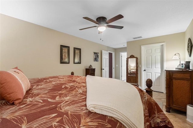 bedroom with light tile patterned flooring and ceiling fan