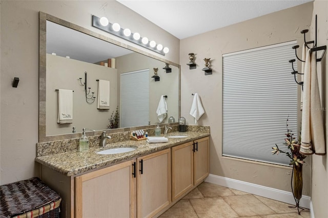 bathroom with tile patterned floors and vanity