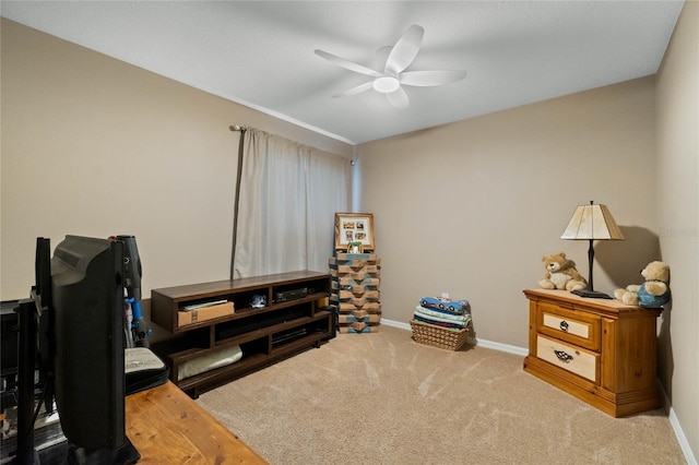 interior space with ceiling fan