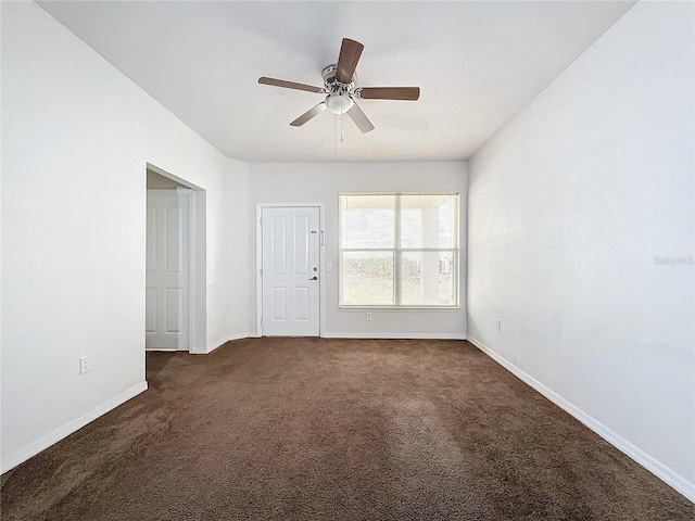 carpeted empty room with ceiling fan