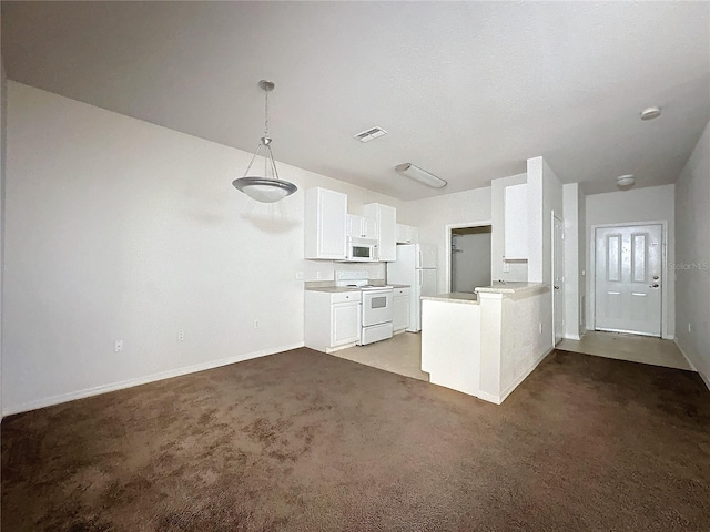 kitchen featuring white cabinetry, kitchen peninsula, dark carpet, decorative light fixtures, and white appliances