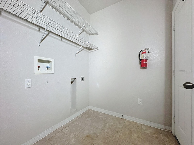 clothes washing area featuring washer hookup and hookup for an electric dryer