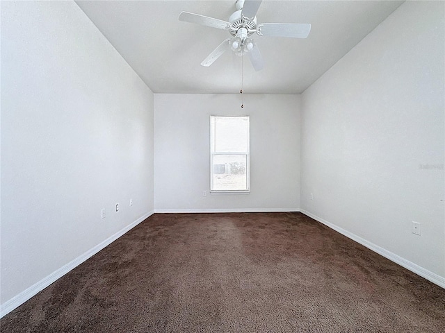 carpeted empty room featuring ceiling fan