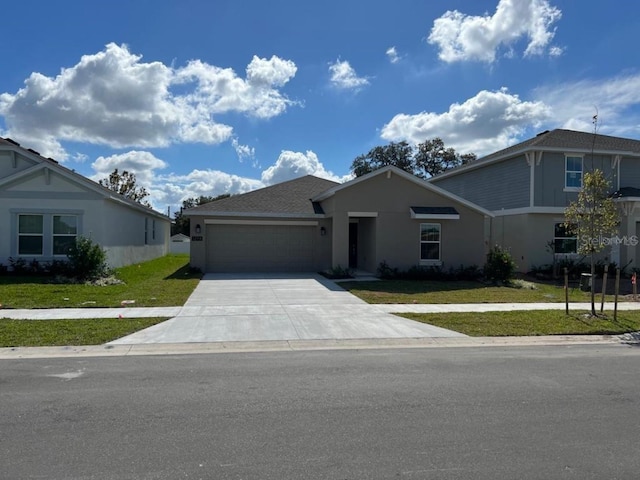 view of front of house with a front lawn and a garage