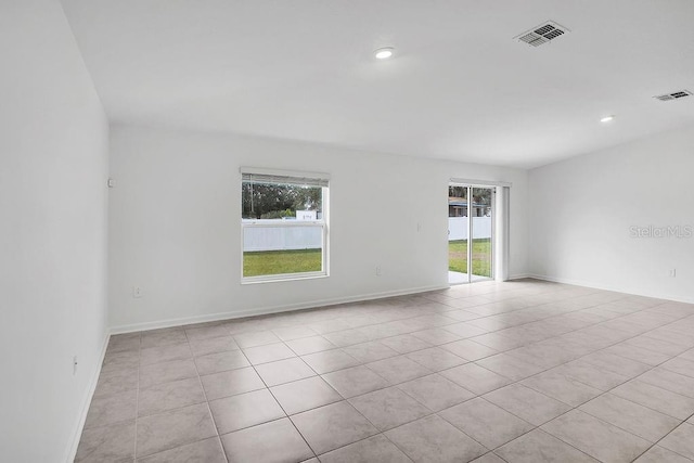 unfurnished room with light tile patterned floors