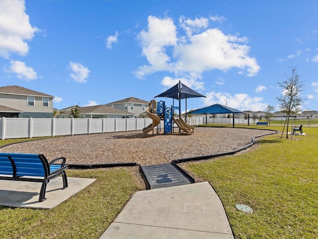 view of jungle gym featuring a lawn