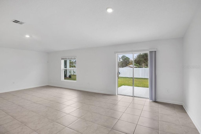 spare room with light tile patterned floors