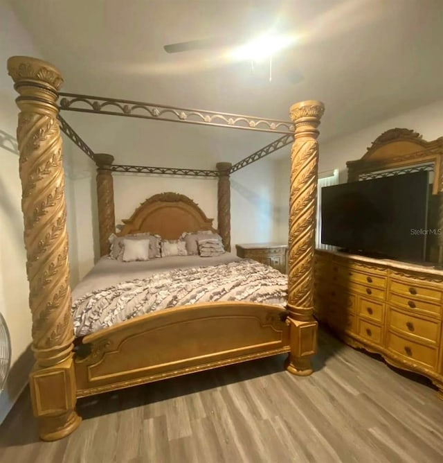 bedroom featuring hardwood / wood-style floors and ceiling fan