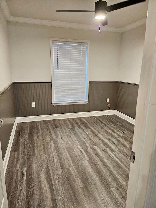 unfurnished room featuring hardwood / wood-style flooring, ceiling fan, and ornamental molding