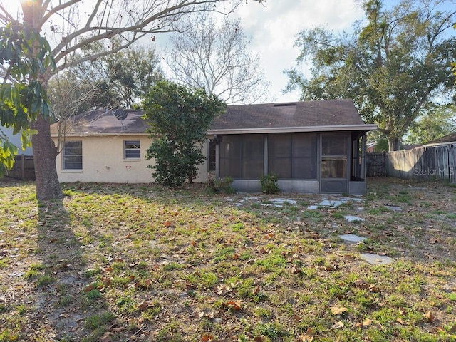 back of house with a sunroom