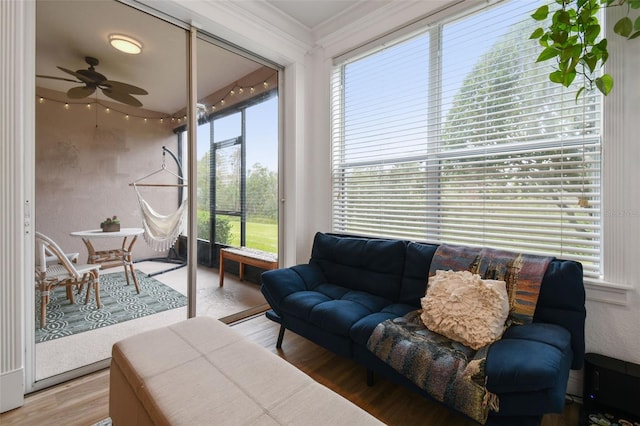 sunroom with ceiling fan and plenty of natural light