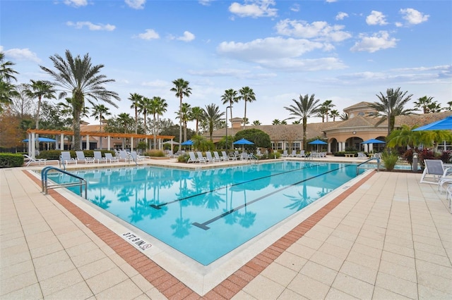 view of swimming pool featuring a patio area