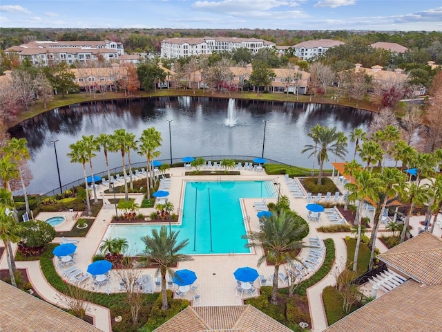 view of swimming pool featuring a water view