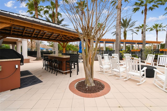 view of patio with a gazebo and a bar