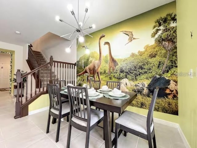 dining space featuring an inviting chandelier and light tile patterned floors