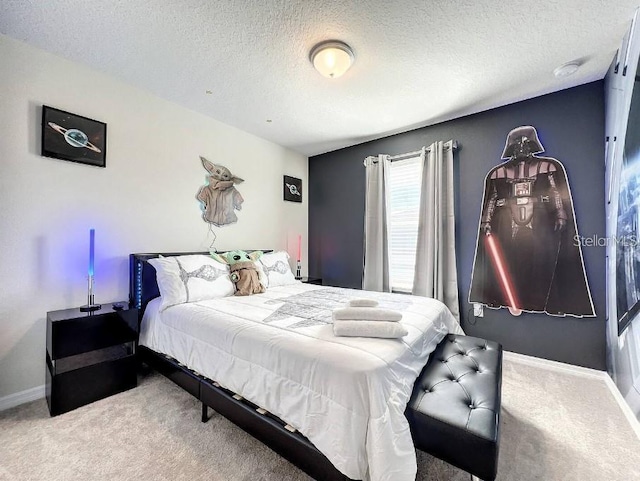 carpeted bedroom featuring a textured ceiling