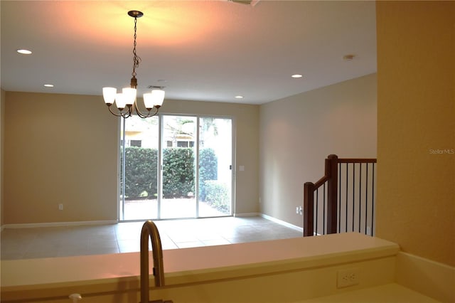 stairs featuring an inviting chandelier